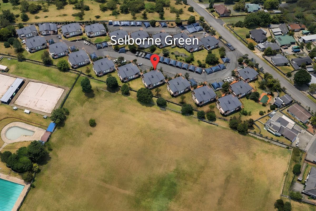 Aerial view of the Selborne Green residential complex, showcasing the layout, communal swimming pool, and surrounding landscaped grounds.