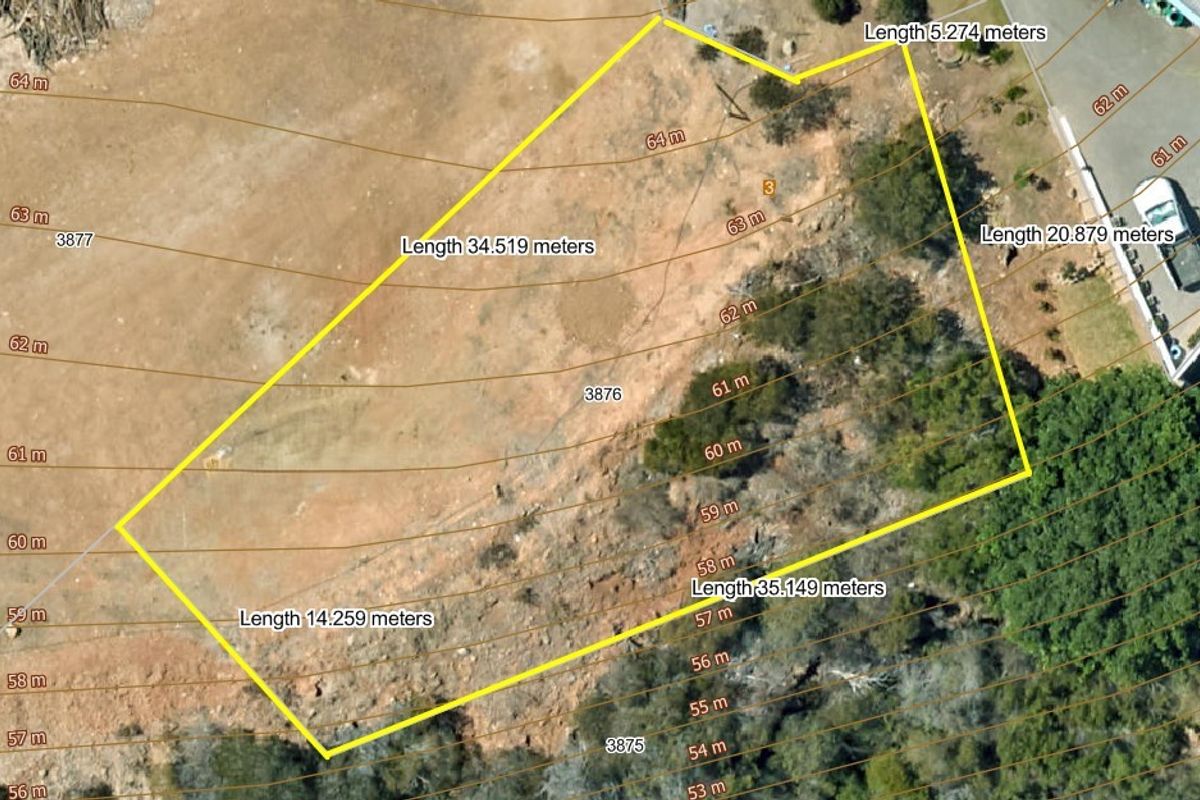 Aerial view of a vacant residential plot featuring topographical contour lines and clearly marked boundary dimensions for development planning.