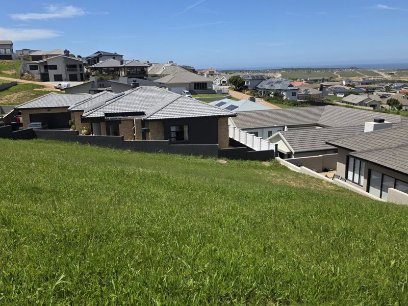 A view of the surrounding residential estate and landscape from the elevated vacant land plot.