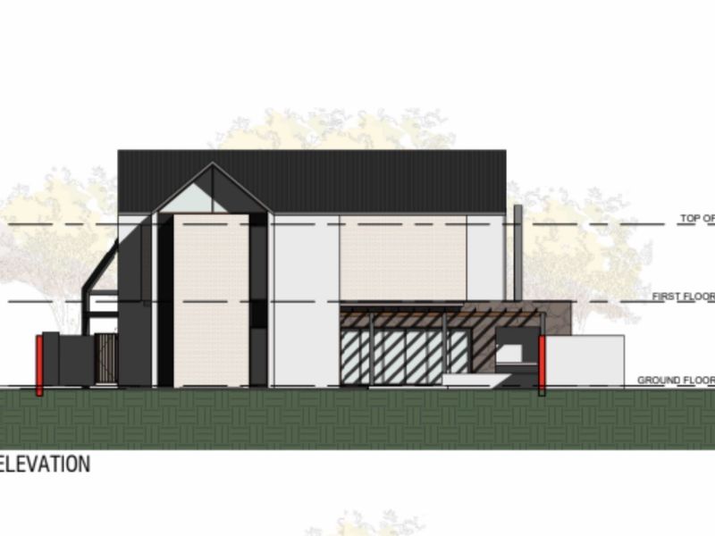 Architectural south elevation drawing showing the building facade, roof structure, and ground floor layout details.