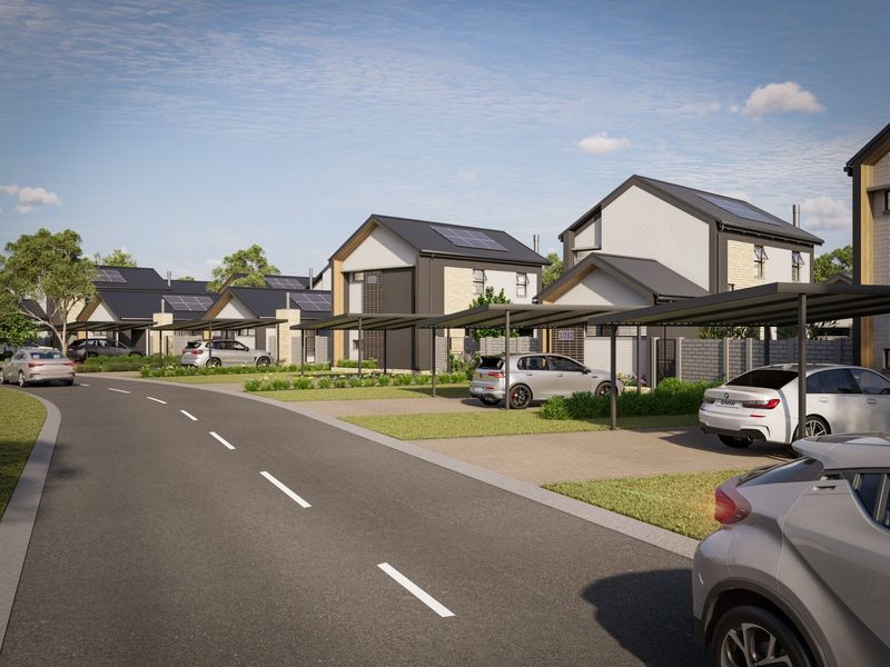 A modern residential street view featuring contemporary homes with solar panels, paved driveways, and covered carports in a well-planned estate setting.