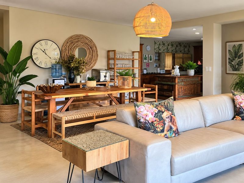 Spacious open-plan living and dining area featuring polished concrete floors, neutral walls, and a seamless transition into the kitchen space.