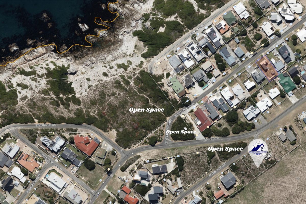 An aerial view of the residential area showing vacant land parcels and surrounding coastal infrastructure.