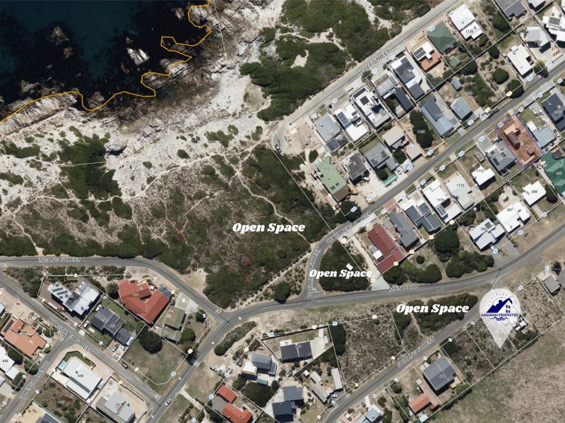 An aerial view of the residential area showing vacant land parcels and surrounding coastal infrastructure.