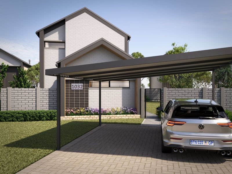 Modern front elevation featuring a paved driveway, functional carport, and secure brick boundary wall with a metal gate.