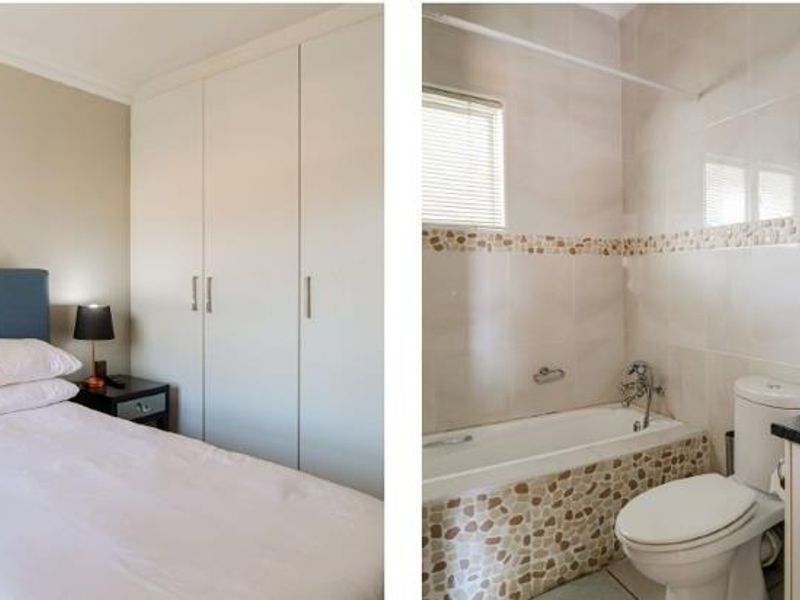 A bedroom featuring built-in cupboards and neutral wall finishes.