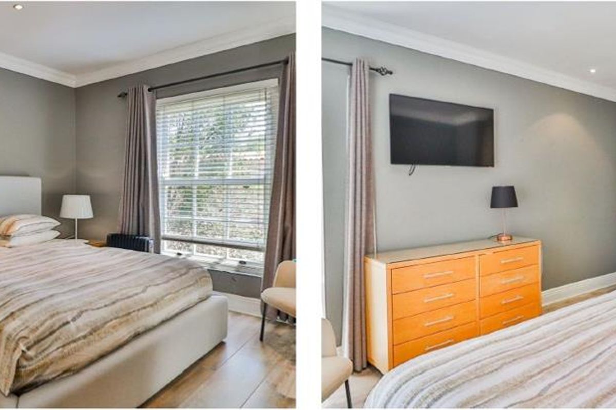 A well-maintained bedroom featuring laminate flooring, recessed downlighting, crown molding, and built-in cupboards.
