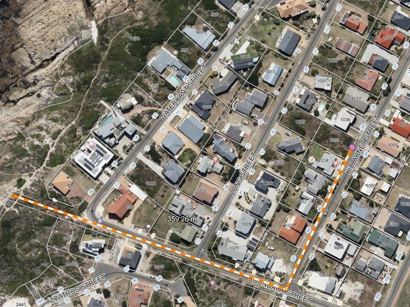 An aerial satellite view showing the residential street layout and coastal proximity of the property area.