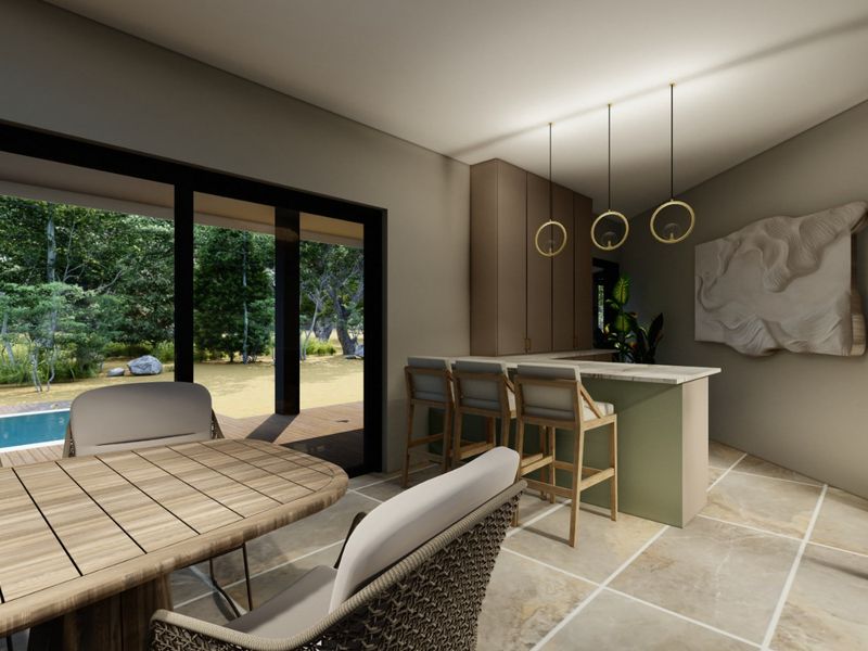 Modern open-plan living area featuring a built-in bar, elegant pendant lighting, and large sliding doors opening to an outdoor patio and pool area.
