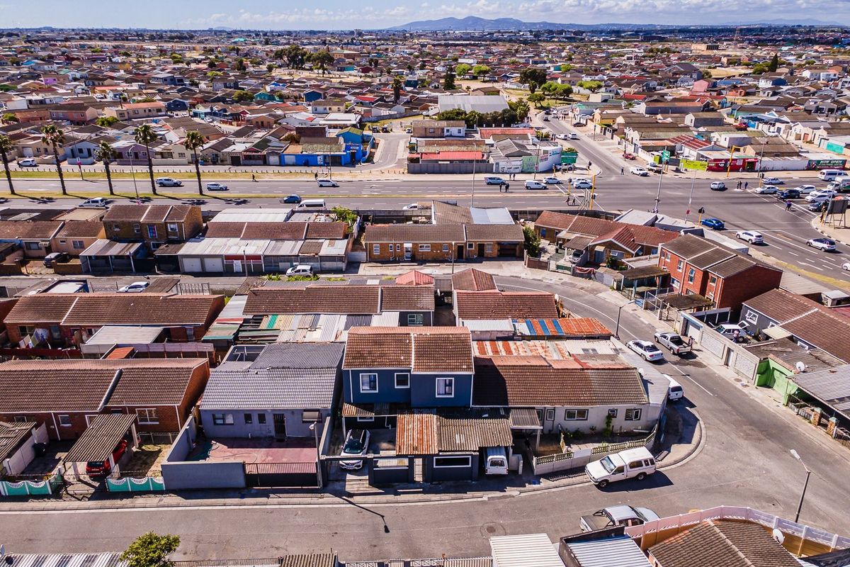 An aerial view of the residential property showing the roof structure, driveway, and surrounding neighbourhood context.
