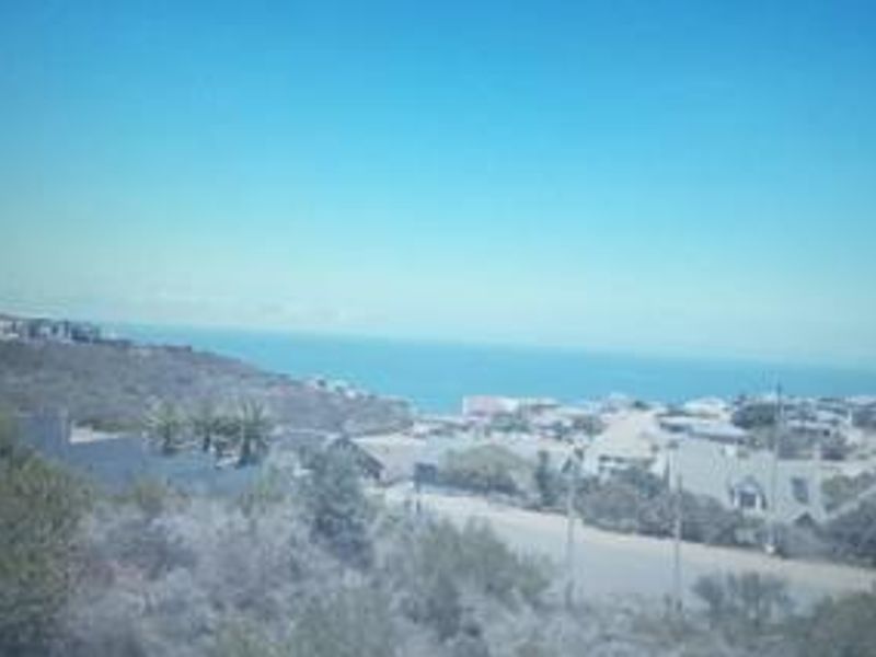 An elevated view overlooking the surrounding residential neighborhood and the distant ocean coastline.