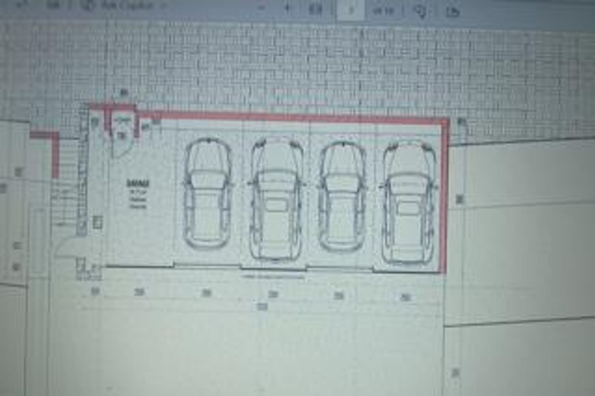 A digital floor plan showing a four-car garage layout with dimensions.
