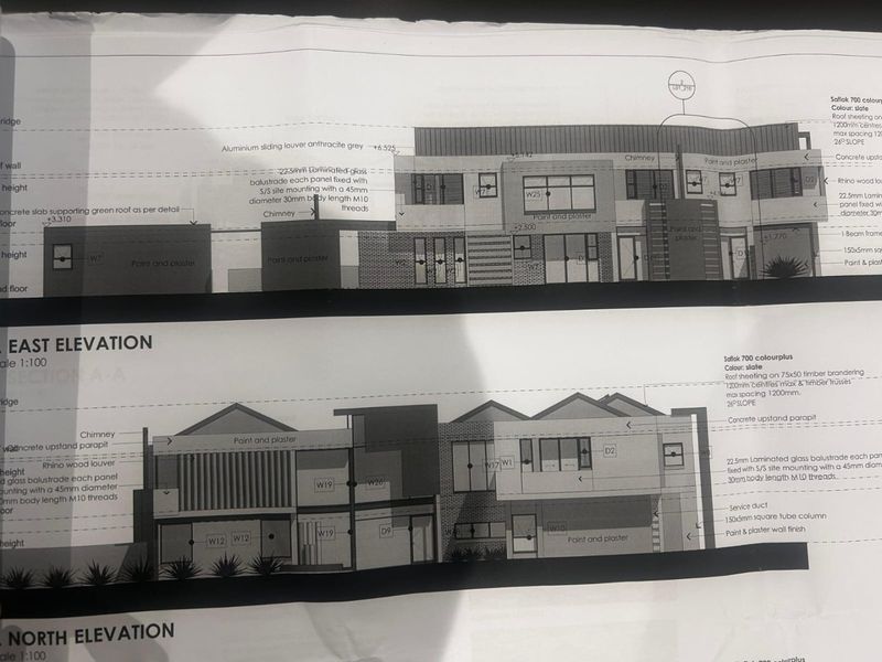 Architectural elevation drawings for the proposed residential property, detailing exterior finishes, roof structure, and balustrade specifications.