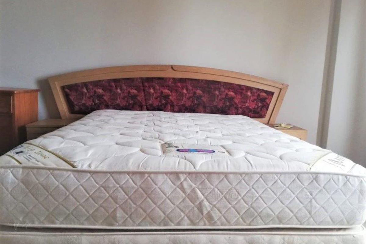 A standard bedroom space featuring neutral wall finishes, suitable for personalization and modern interior updates.