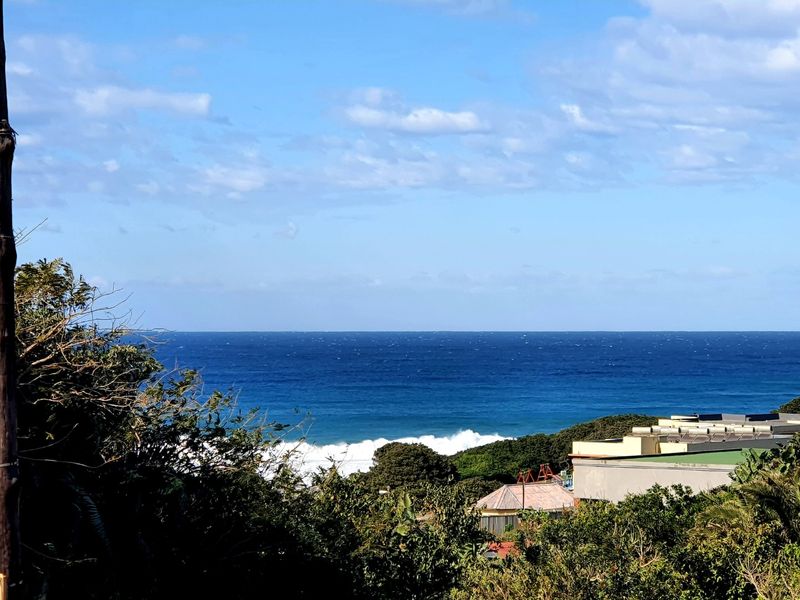 A scenic elevated view overlooking the ocean and surrounding coastal landscape.