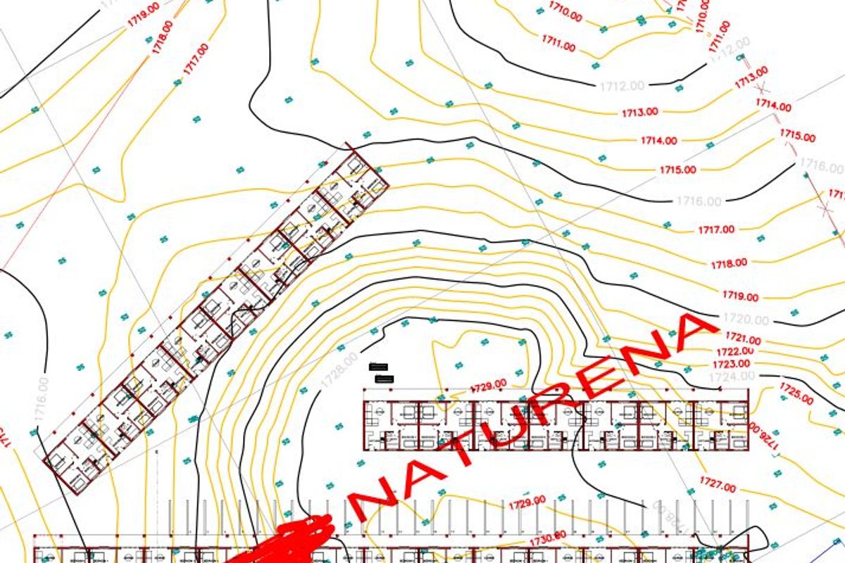 A topographical site plan showing the layout of commercial building blocks and elevation contours for the Naturena development site.