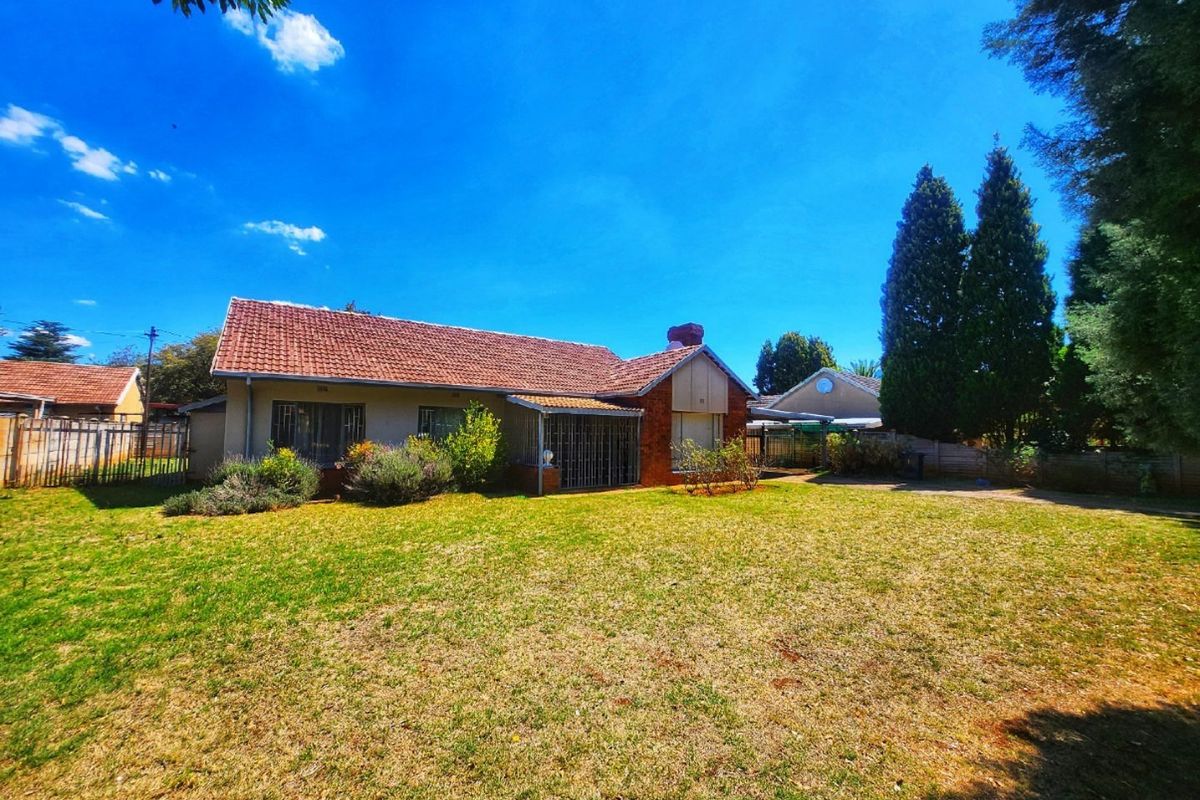This 3-bedroom family home in Stilfontein offers space, security, and comfort for modern living. - Photo 3