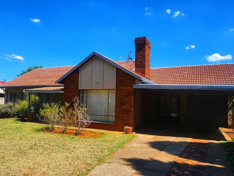 This 3-bedroom family home in Stilfontein offers space, security, and comfort for modern living. - Photo 2