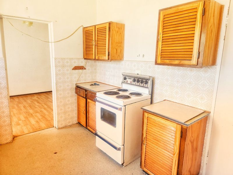 This 3-bedroom family home in Stilfontein offers space, security, and comfort for modern living. - Photo 8