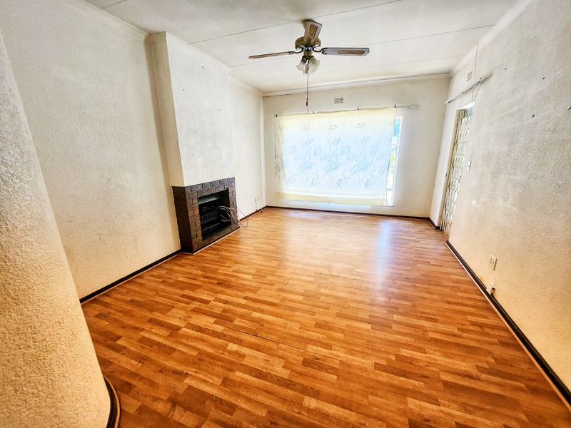 This 3-bedroom family home in Stilfontein offers space, security, and comfort for modern living. - Photo 6