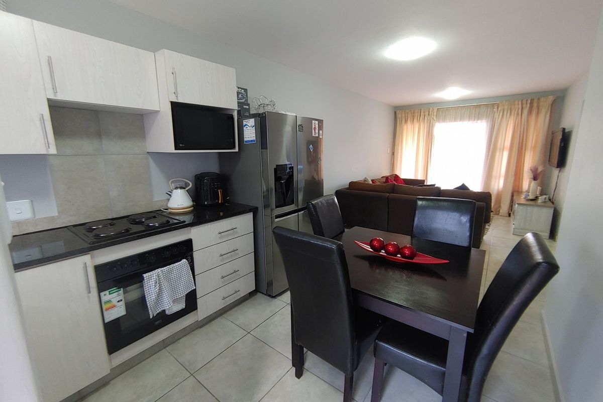 Discover this perfectly positioned 2-bedroom ground floor unit, designed for comfort and convenience. - Photo 2