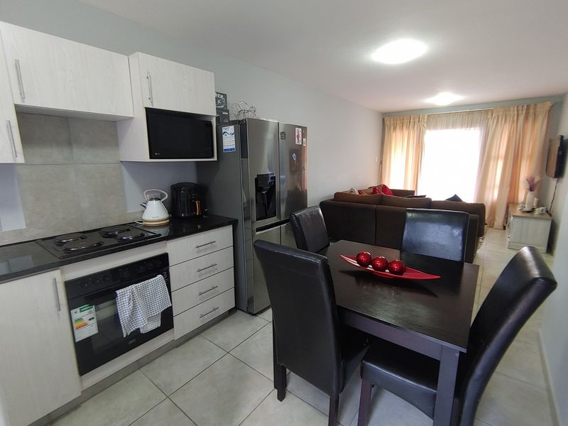 Discover this perfectly positioned 2-bedroom ground floor unit, designed for comfort and convenience. - Photo 2