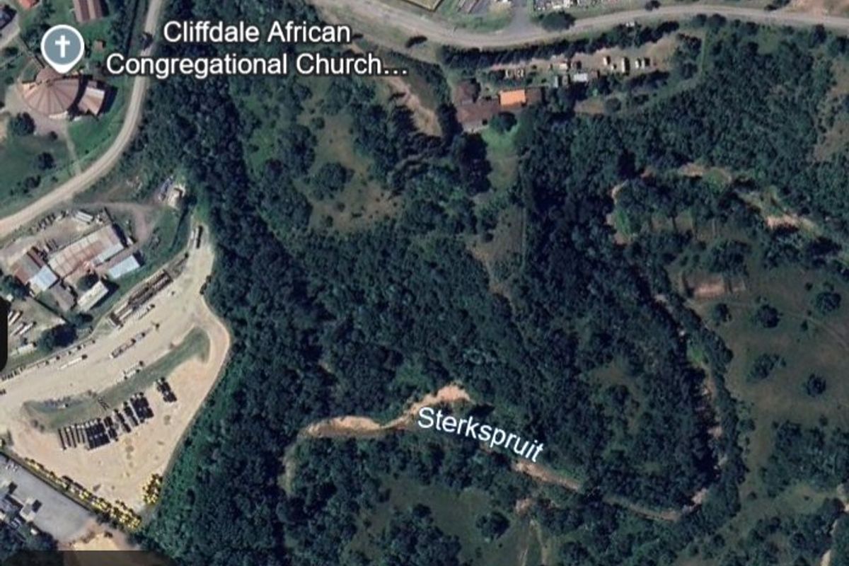 An aerial satellite view of the property location showing surrounding landscape, vegetation, and nearby landmarks.