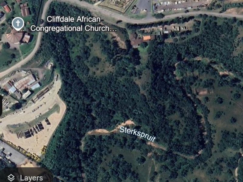 An aerial satellite view of the property location showing surrounding landscape, vegetation, and nearby landmarks.