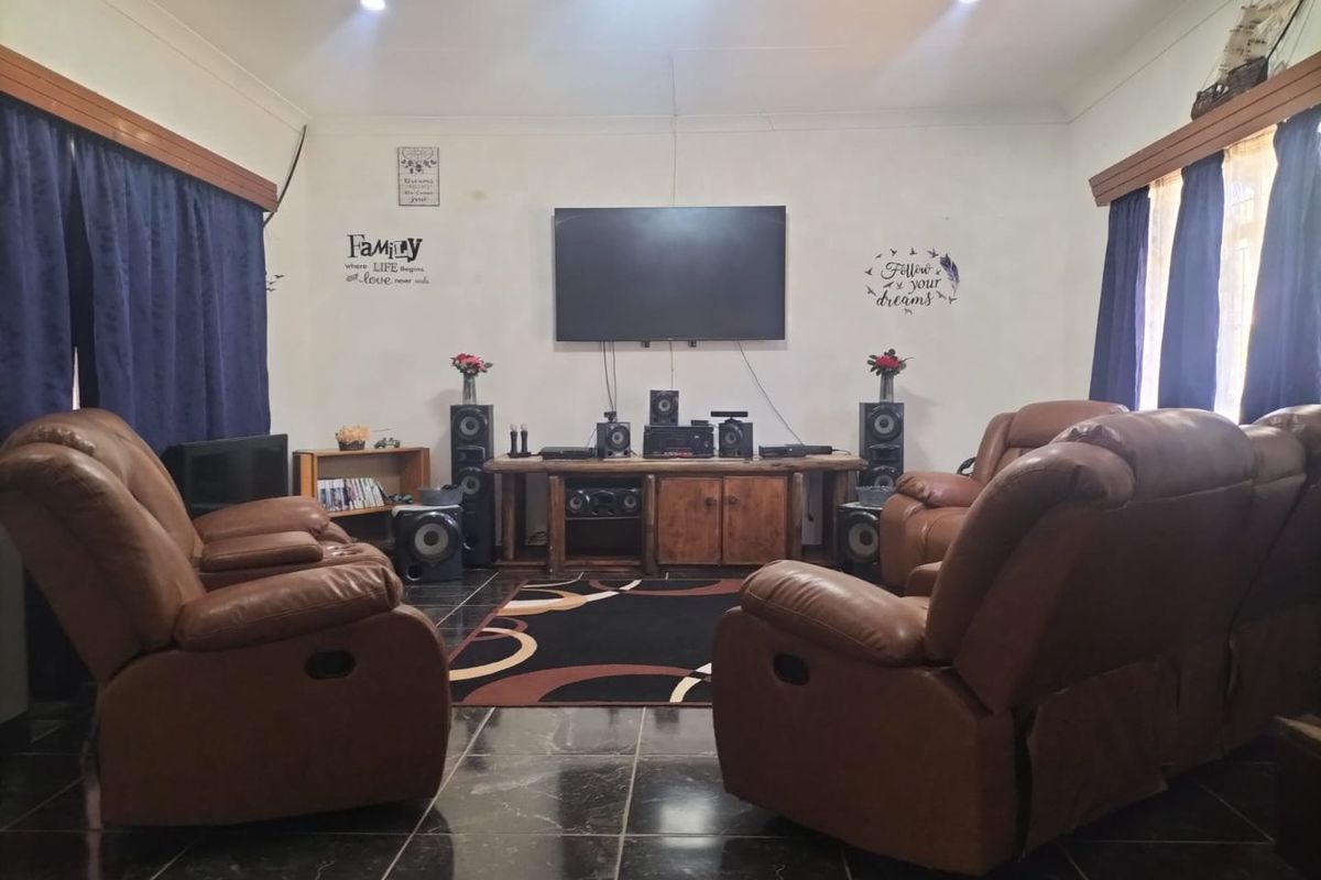 "Spacious 3-Bedroom Home with Generous Outdoor Space and Multiple Parking Options" - Photo 2