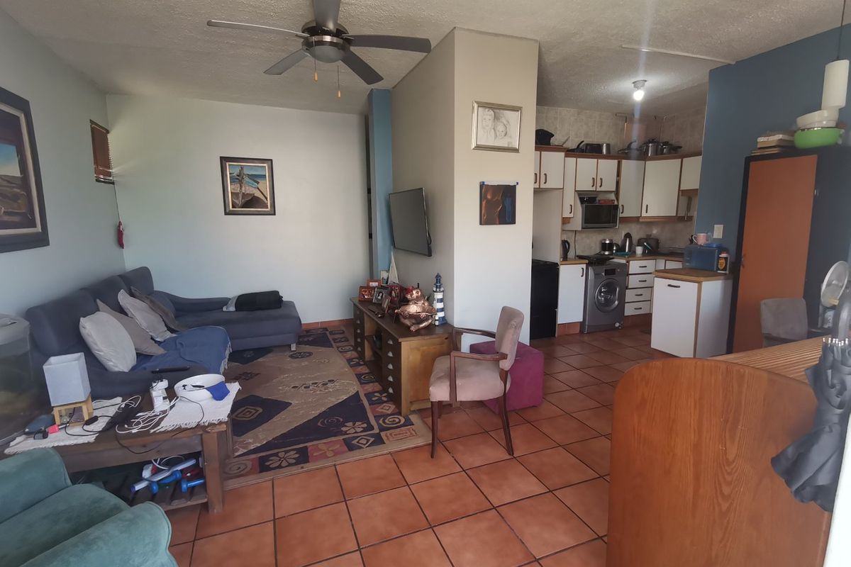 First floor corner unit with wrap around balcony and slight sea view through the trees - Photo 2