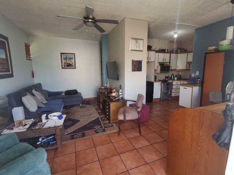 First floor corner unit with wrap around balcony and slight sea view through the trees - Photo 2