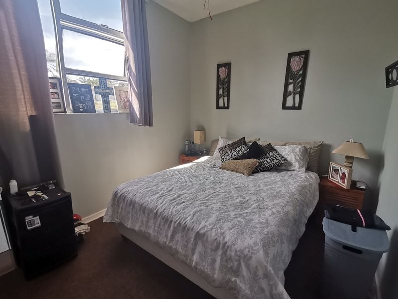 First floor corner unit with wrap around balcony and slight sea view through the trees - Photo 8