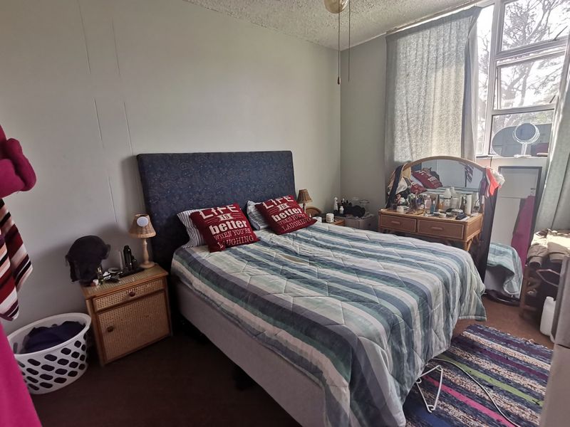 First floor corner unit with wrap around balcony and slight sea view through the trees - Photo 7