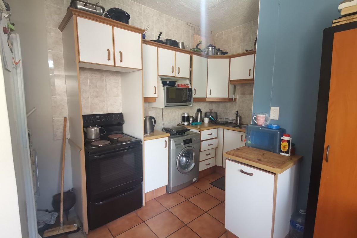 First floor corner unit with wrap around balcony and slight sea view through the trees - Photo 5