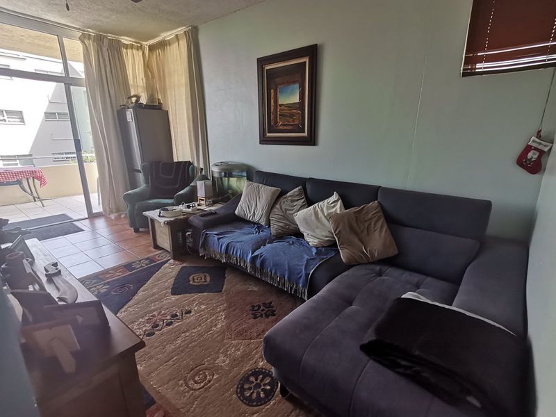 First floor corner unit with wrap around balcony and slight sea view through the trees - Photo 4