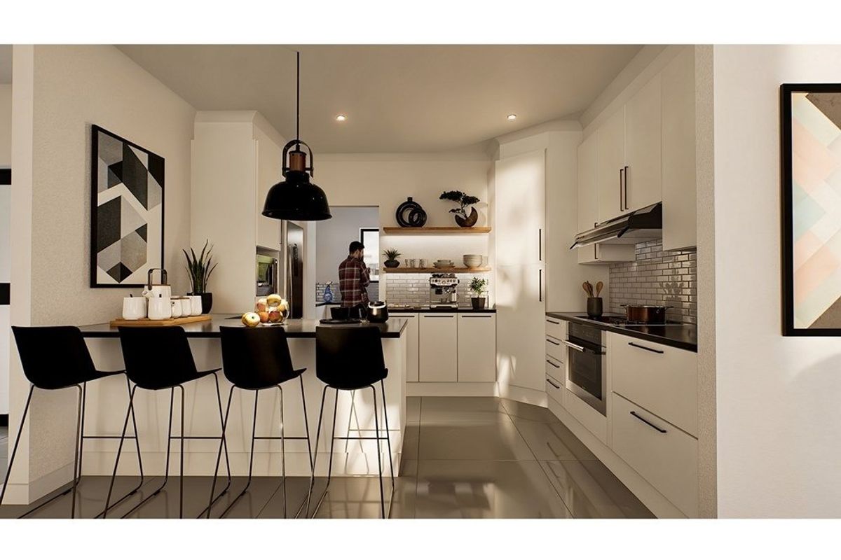 Modern kitchen featuring sleek white cabinetry, a functional island with breakfast bar seating, integrated appliances, and a stylish subway tile backsplash.