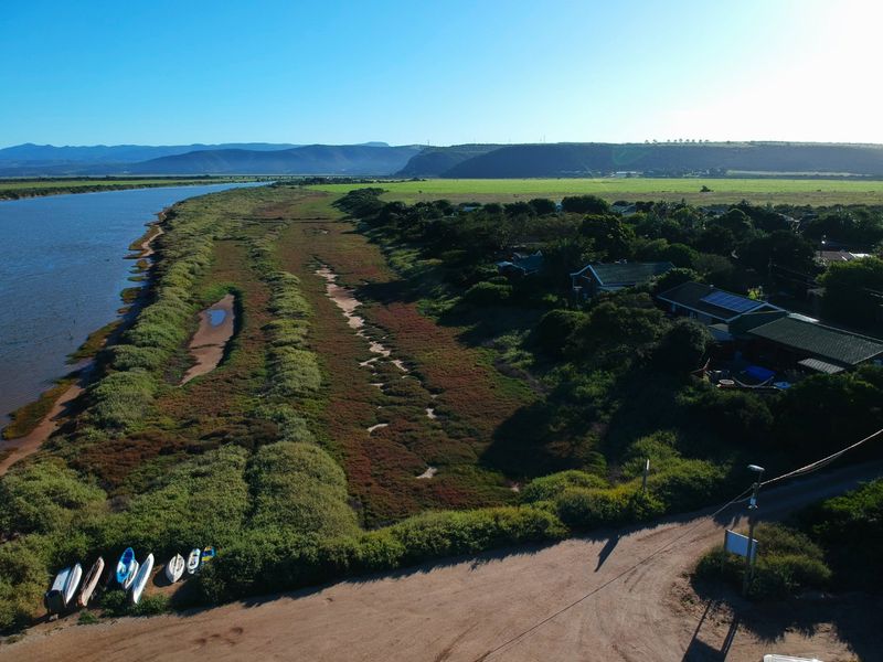 Aerial view of the property location, showcasing the surrounding landscape, river proximity, and residential setting.