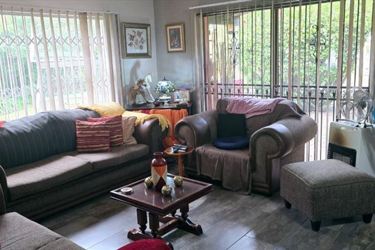 Spacious 3-Bedroom Home with Staff Quarters and Carports for Sale - Photo 2