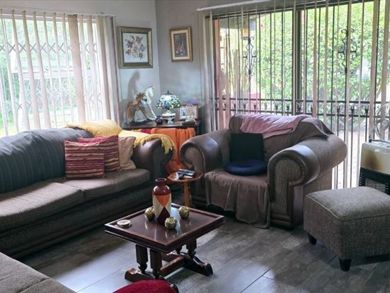 Spacious 3-Bedroom Home with Staff Quarters and Carports for Sale - Photo 2