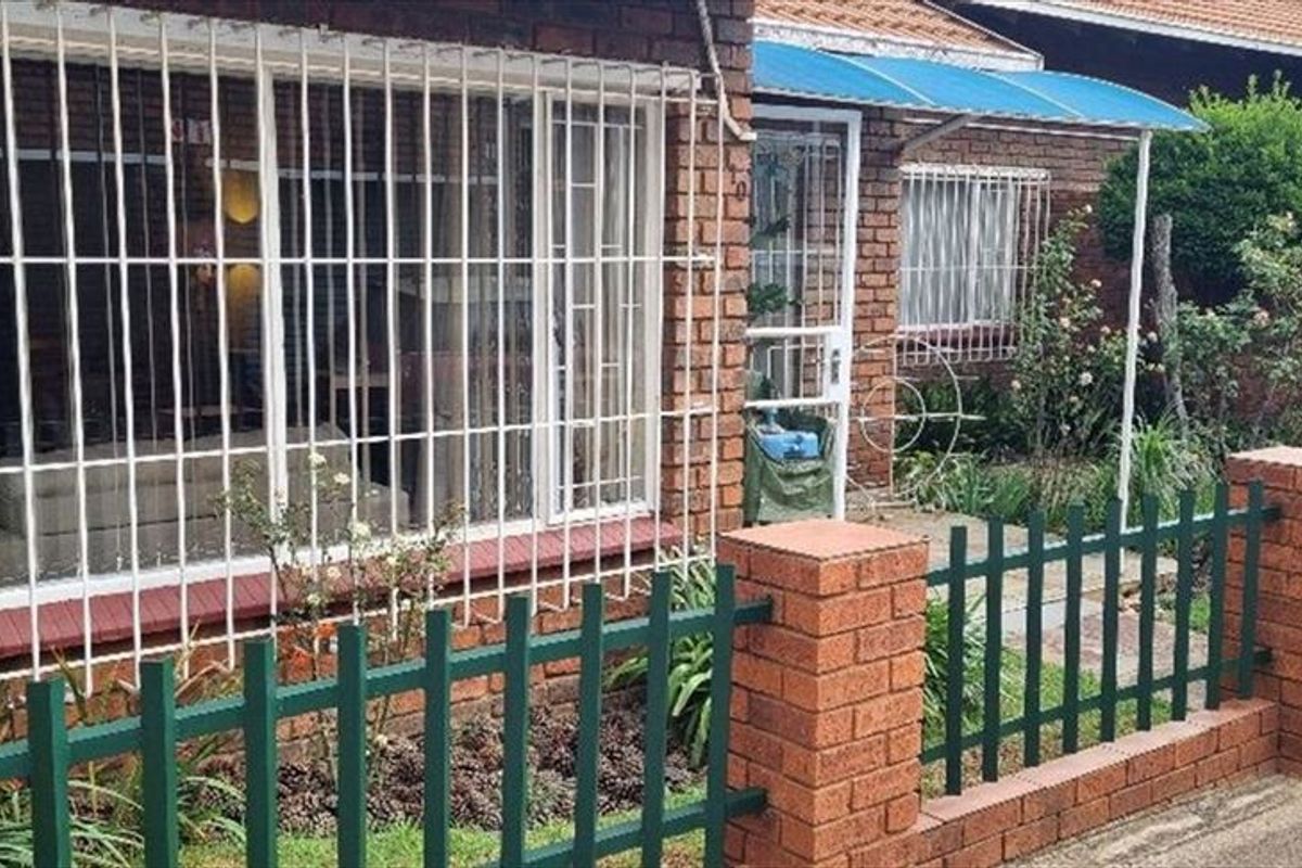 Charming Three-Bedroom Home with Practical Features - Photo 3