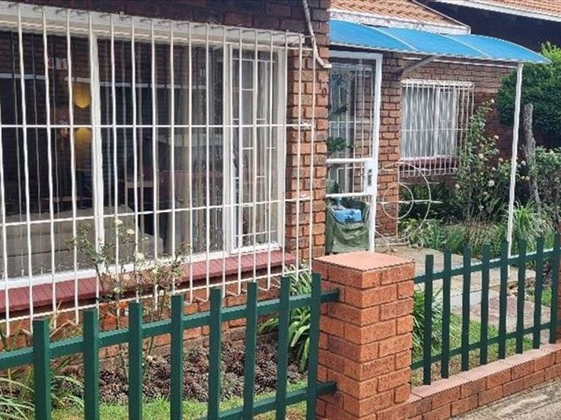 Charming Three-Bedroom Home with Practical Features - Photo 3