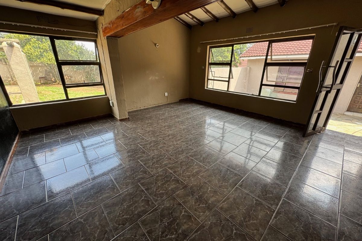 Cozy Three-Bedroom Home with Practical Features - Photo 2