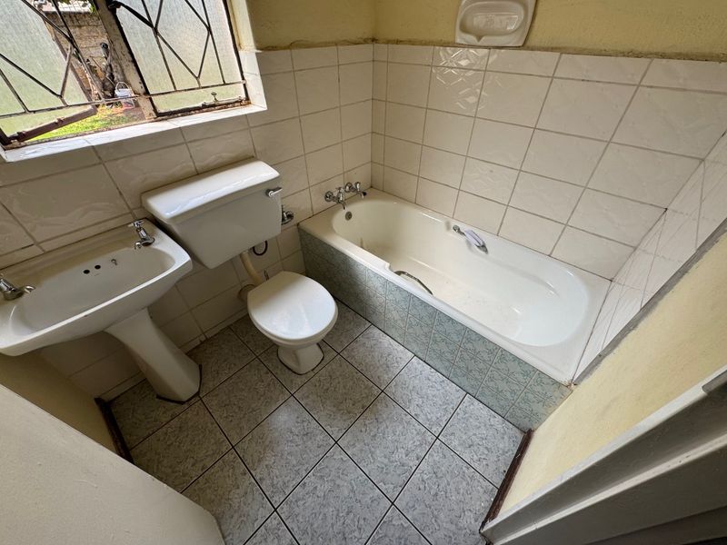 Cozy Three-Bedroom Home with Practical Features - Photo 9