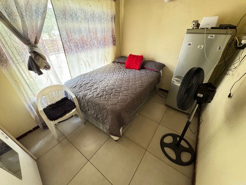 Cozy Three-Bedroom Home with Practical Features - Photo 8