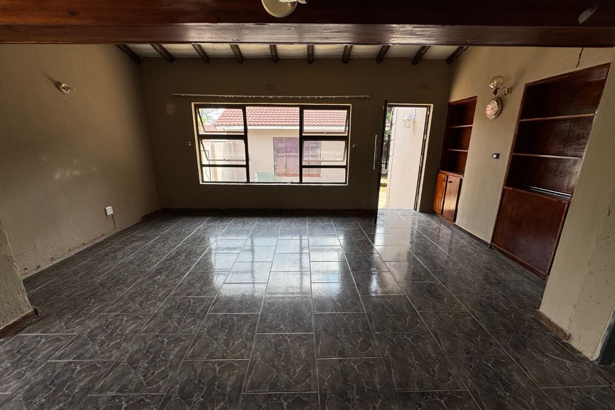 Cozy Three-Bedroom Home with Practical Features - Photo 3