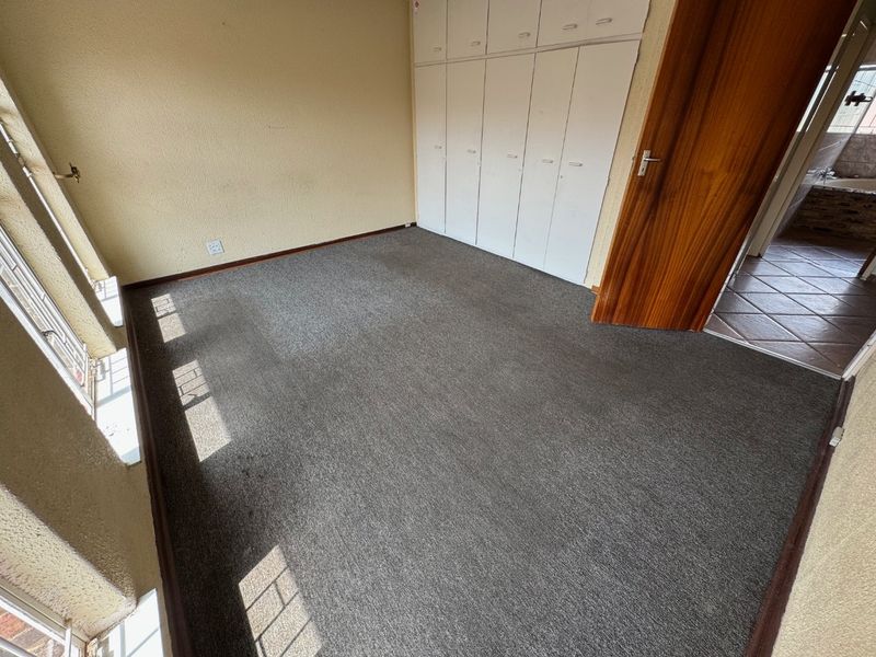 Cozy Two-Bedroom Home with Secure Parking - Photo 8