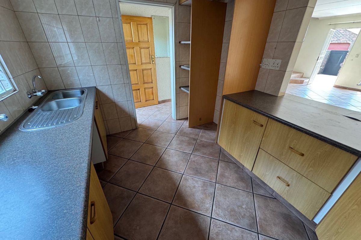 Cozy Two-Bedroom Home with Secure Parking - Photo 3