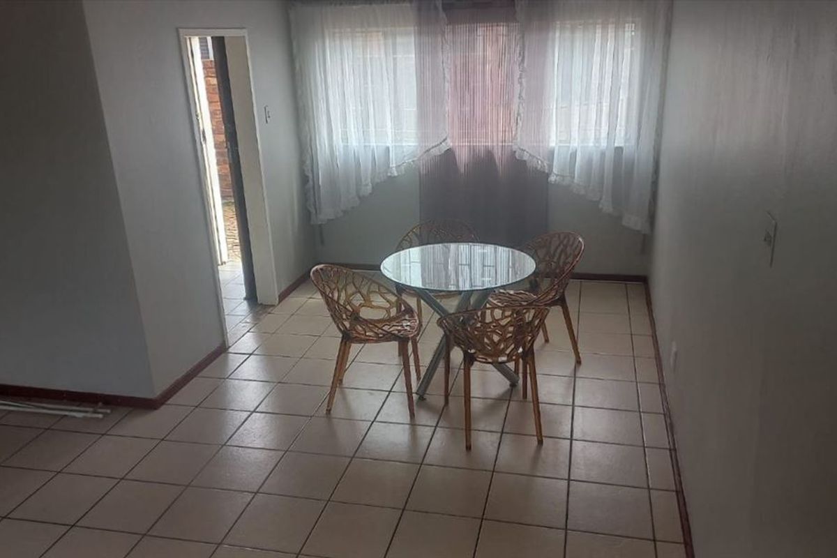 Cozy Two-Bedroom Home with Secure Parking - Photo 2