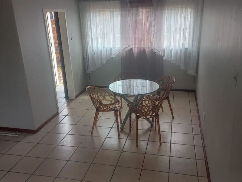 Cozy Two-Bedroom Home with Secure Parking - Photo 2