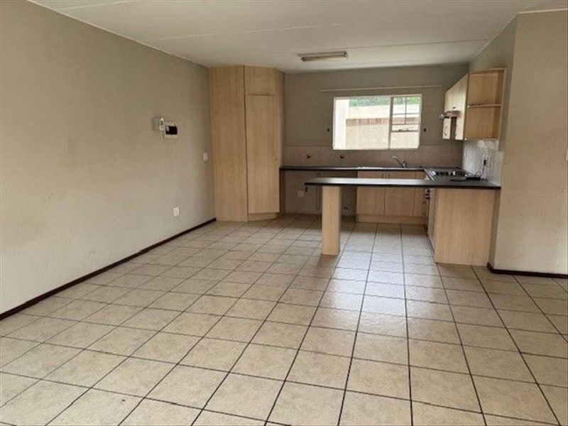 Cozy Two-Bedroom Home with Secure Parking - Photo 2